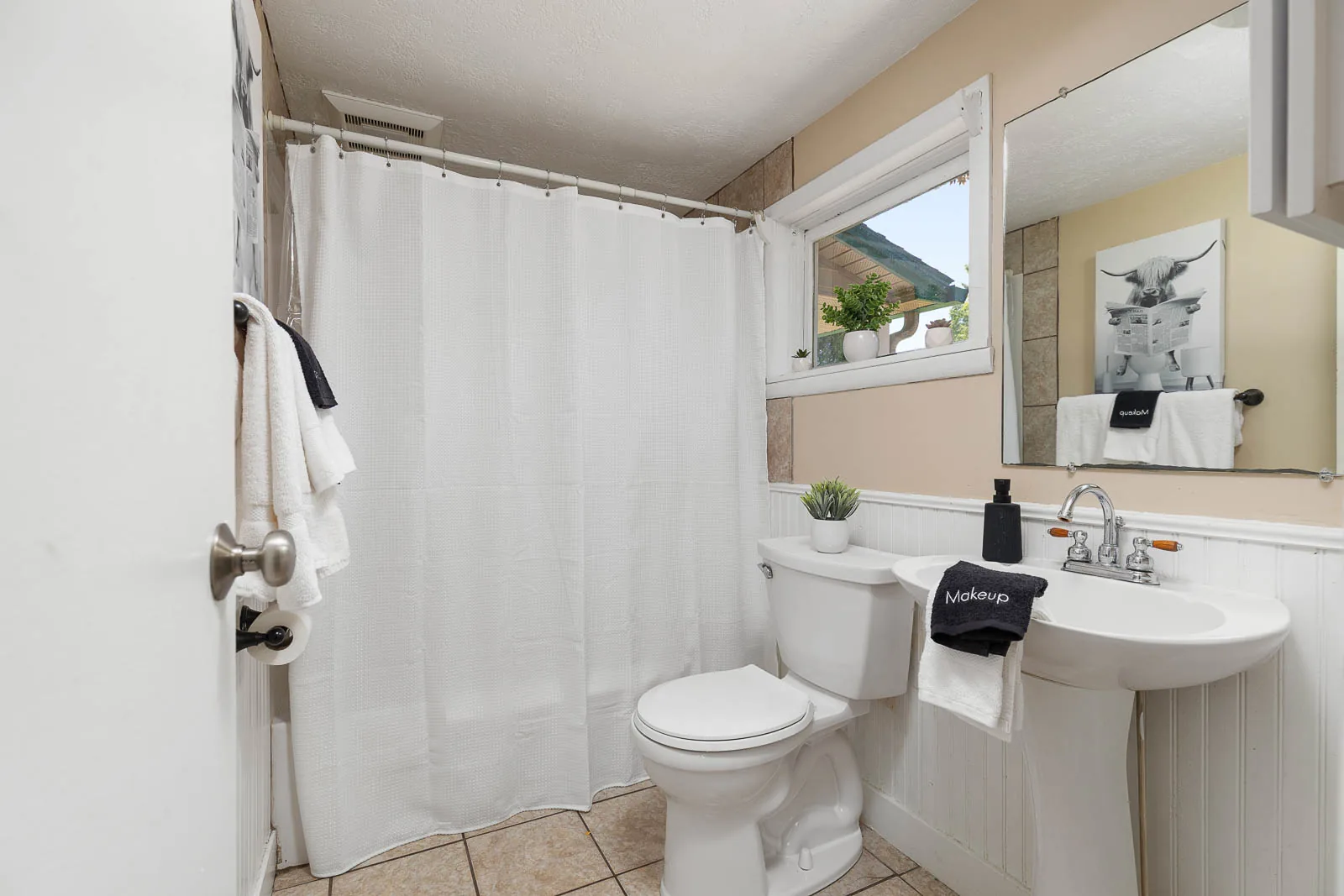 Full bathroom with tub and shower in The House