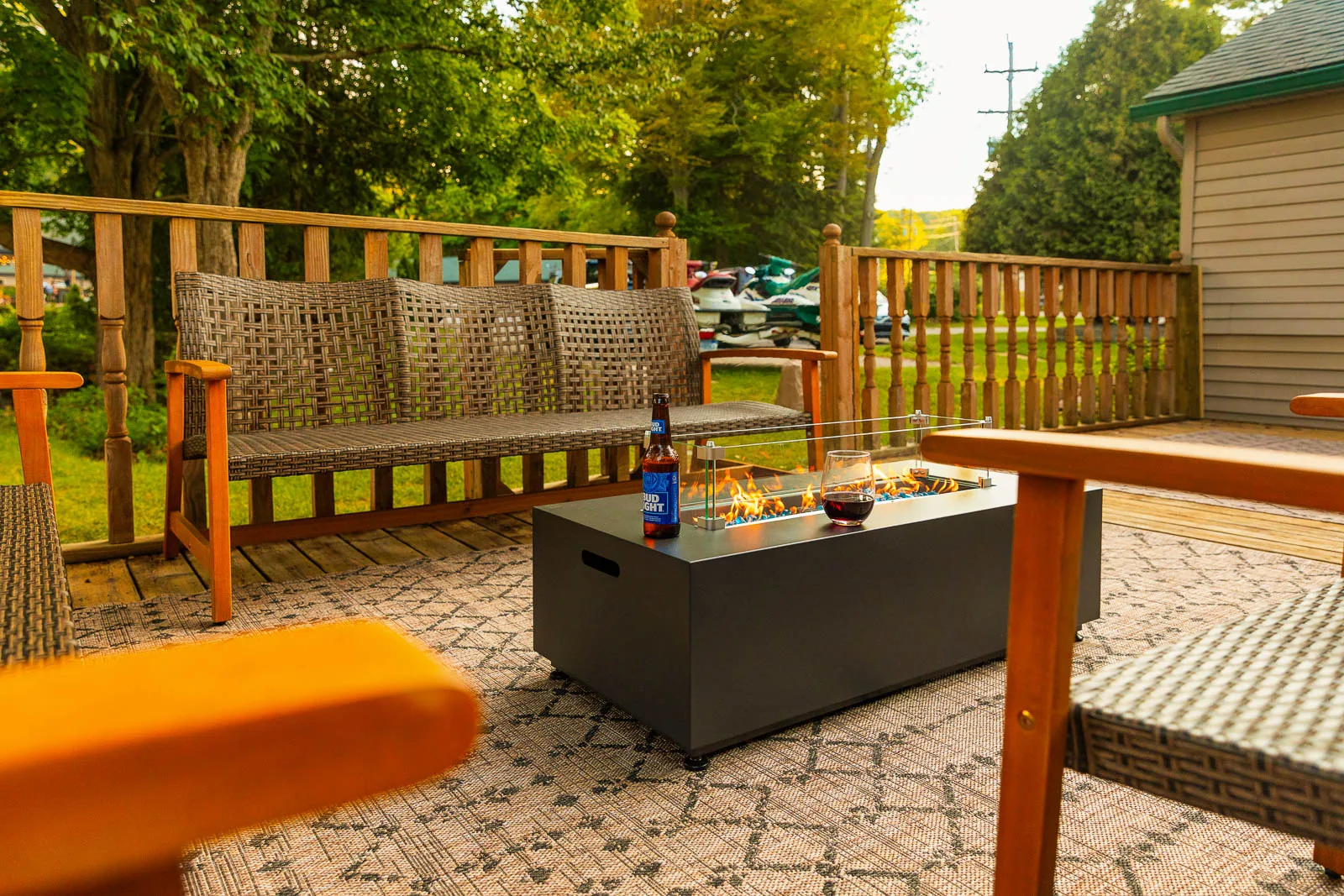 Private deck with outdoor seating and fire table at The House