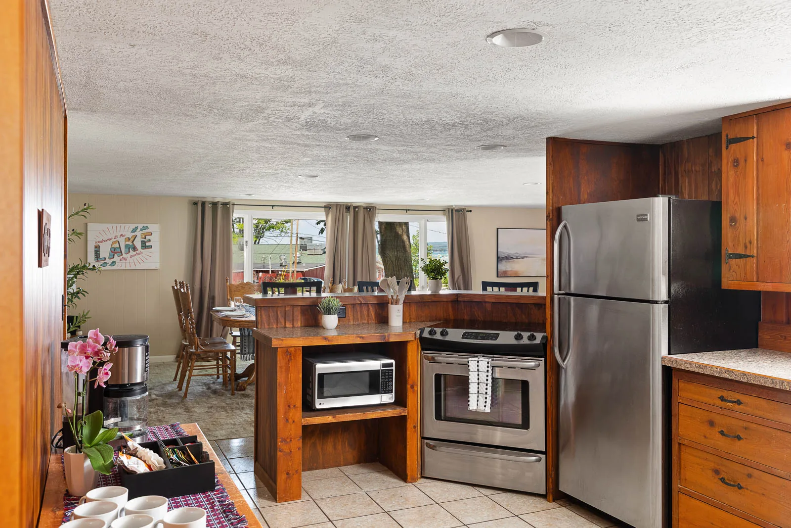 Full kitchen with dining nearby in The House