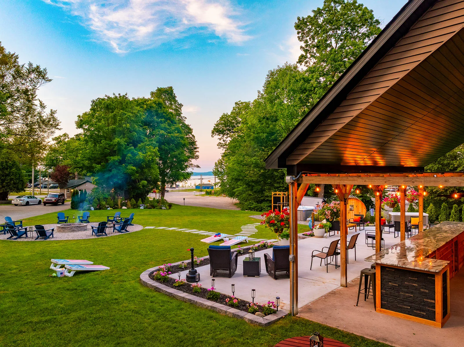 Outdoor pavilion, lawn games, and lake views at The Sandbar Lodge