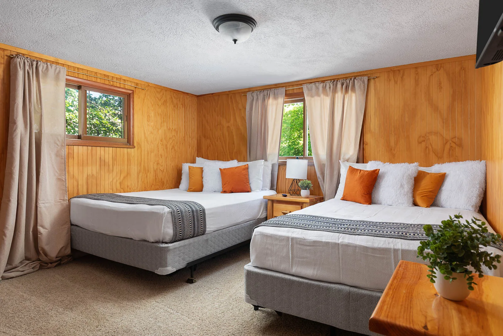 Bedroom with two full beds inside The House