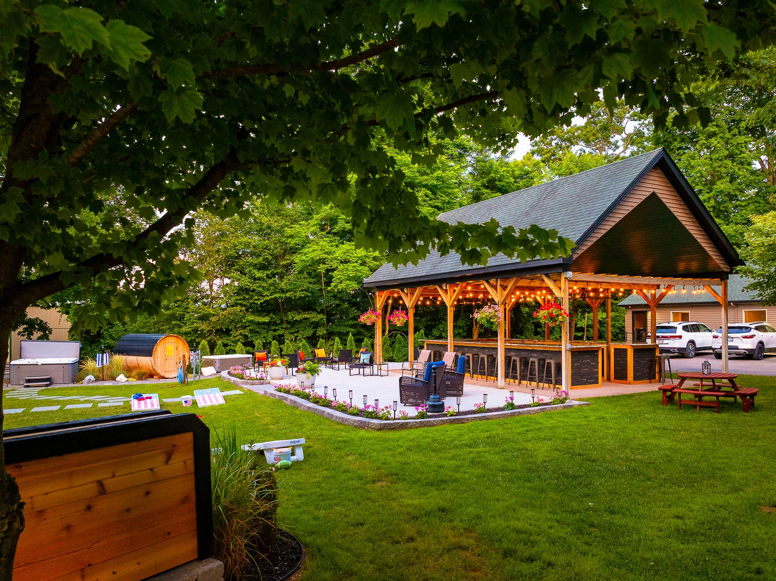 Covered outdoor pavilion and lawn games at The Sandbar Lodge