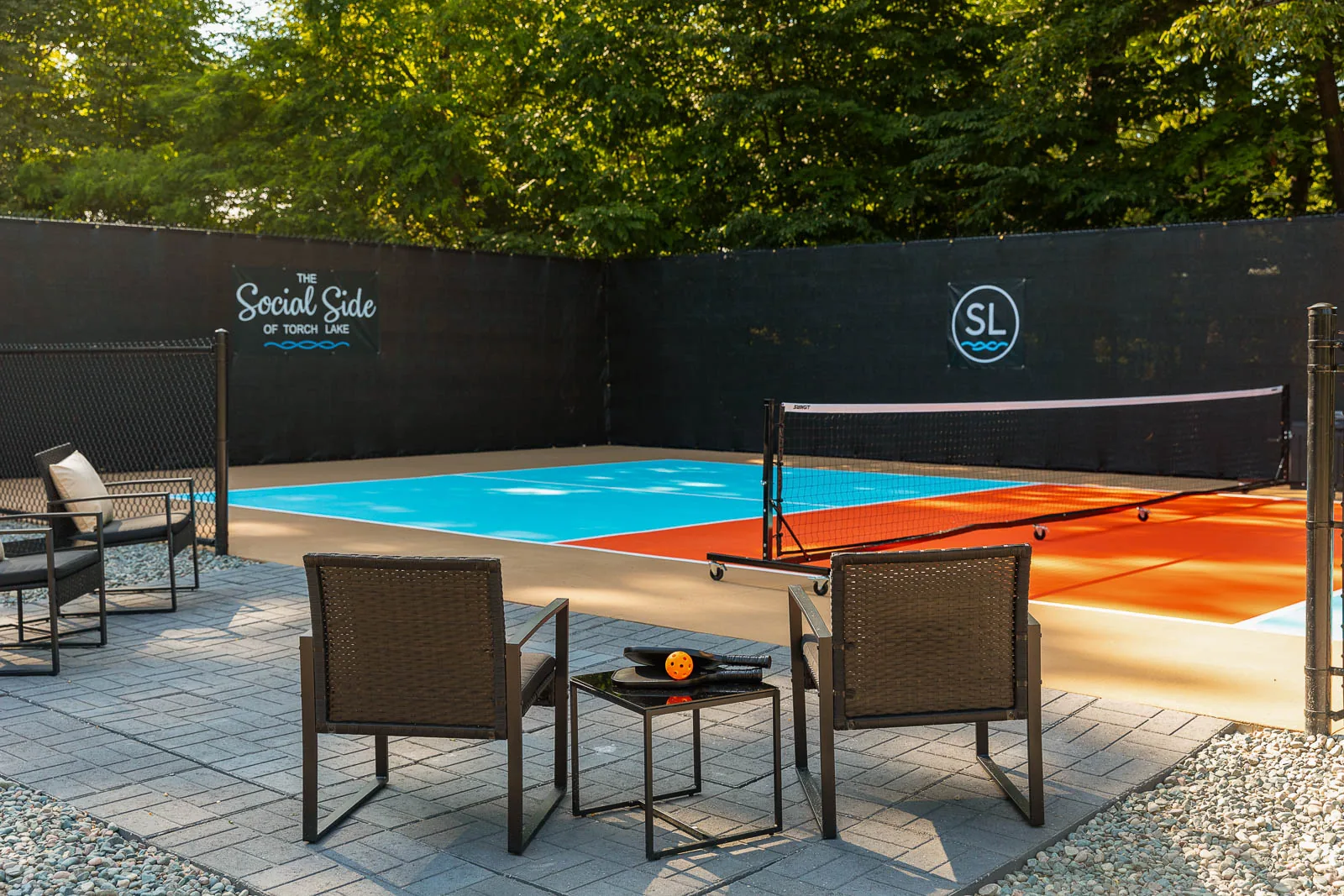 Pickleball court with guest seating at The Sandbar Lodge