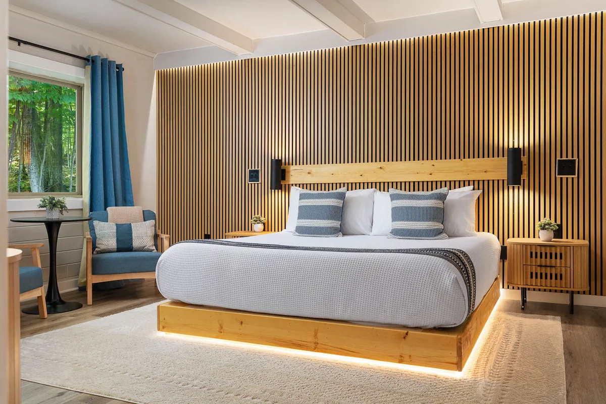 King Lodge Suite with a king bed and warm wood accent wall