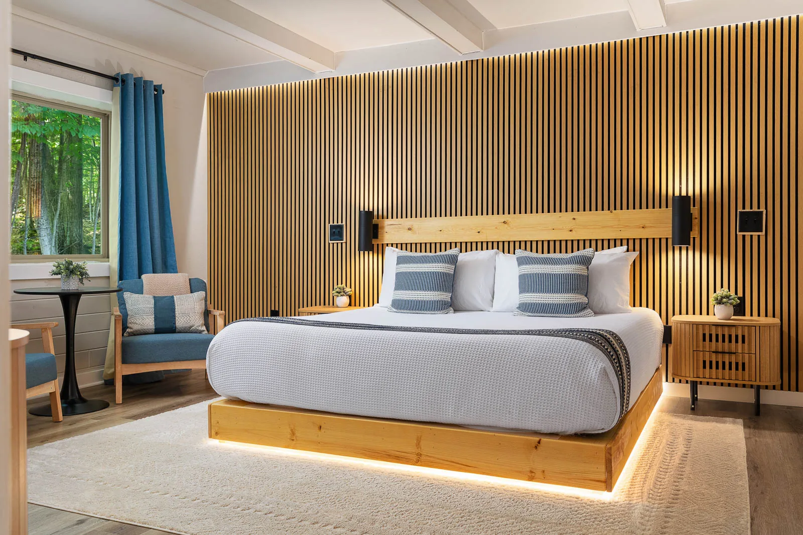 King Lodge Suite with a king bed and warm wood accent wall