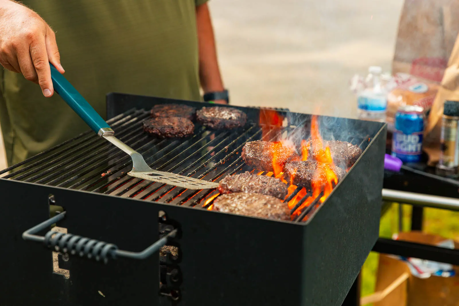 Burgers cooking on an outdoor grill