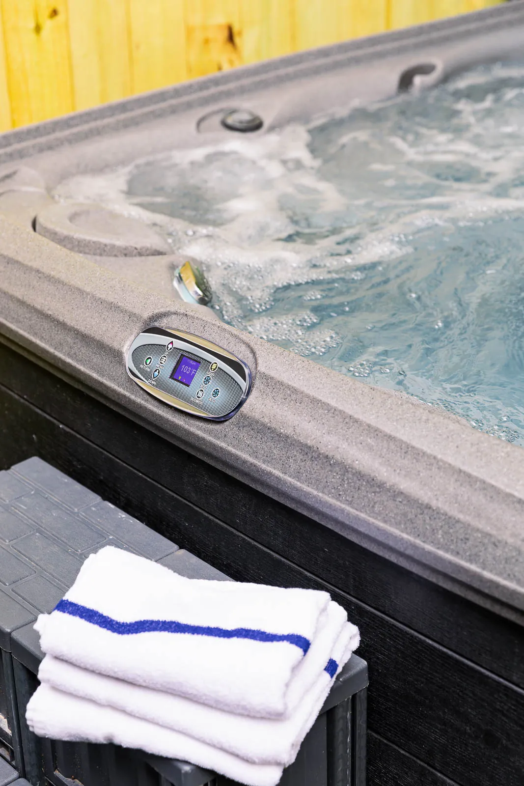 Hot tub water and folded towels detail