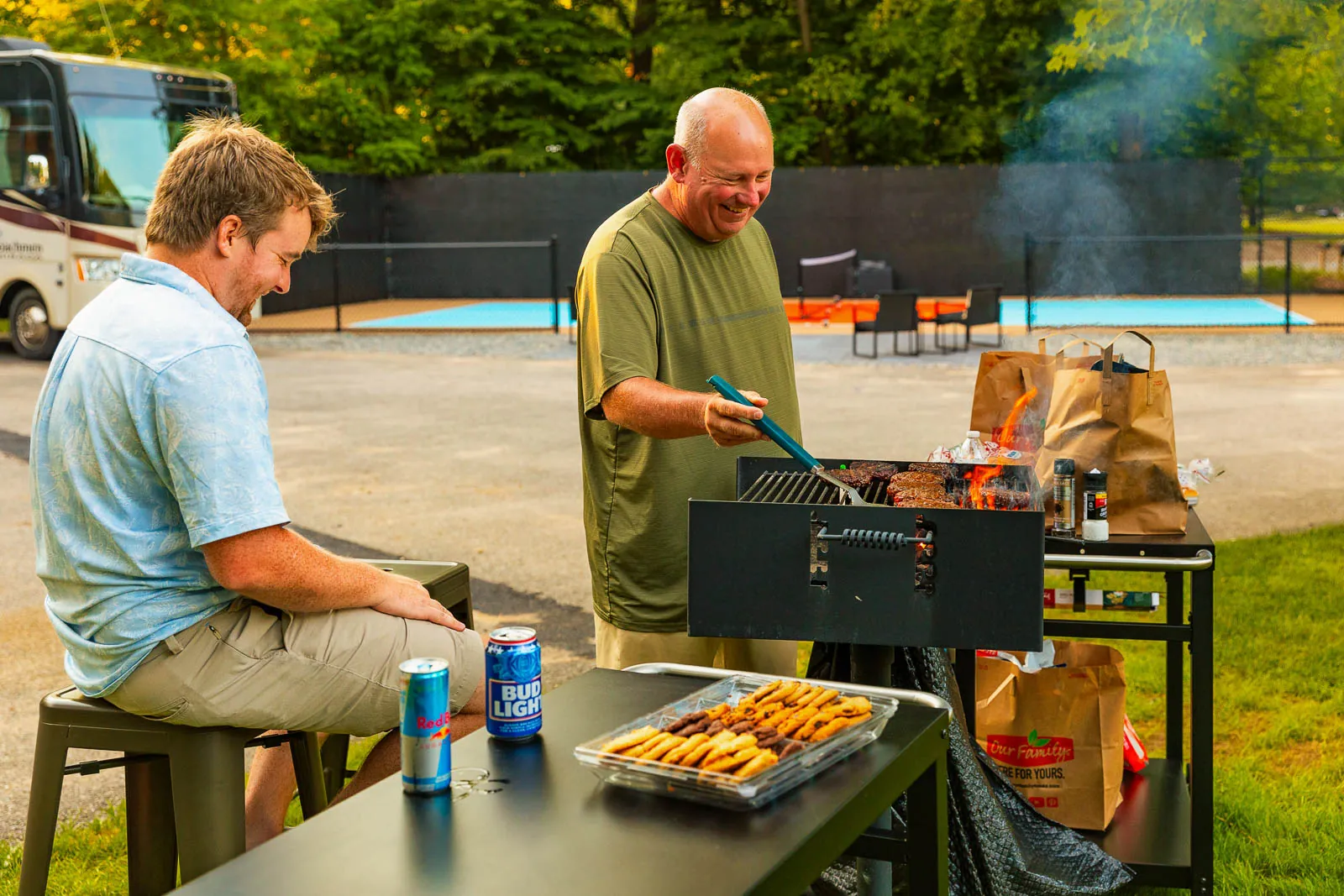 Guests grilling outdoors by the pickleball court