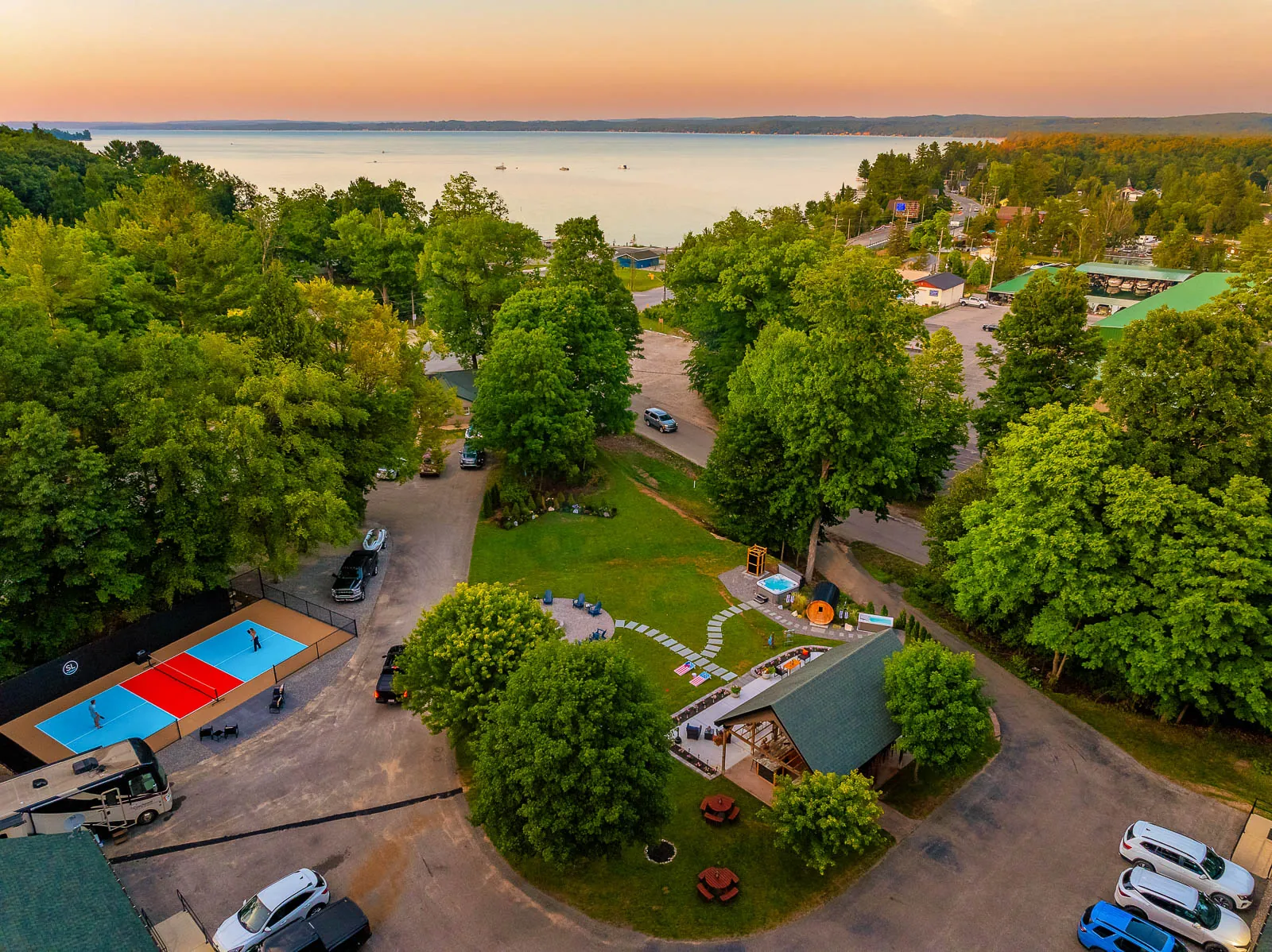 Sunset aerial view of The Sandbar Lodge property