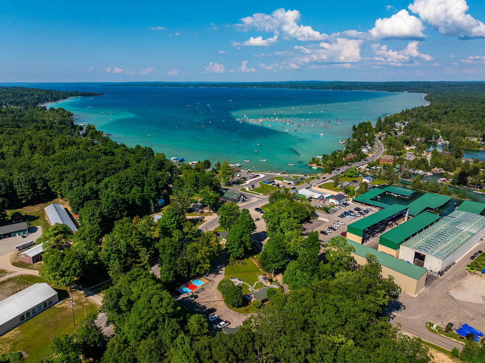 Aerial view of Torch Lake with The Sandbar Lodge below