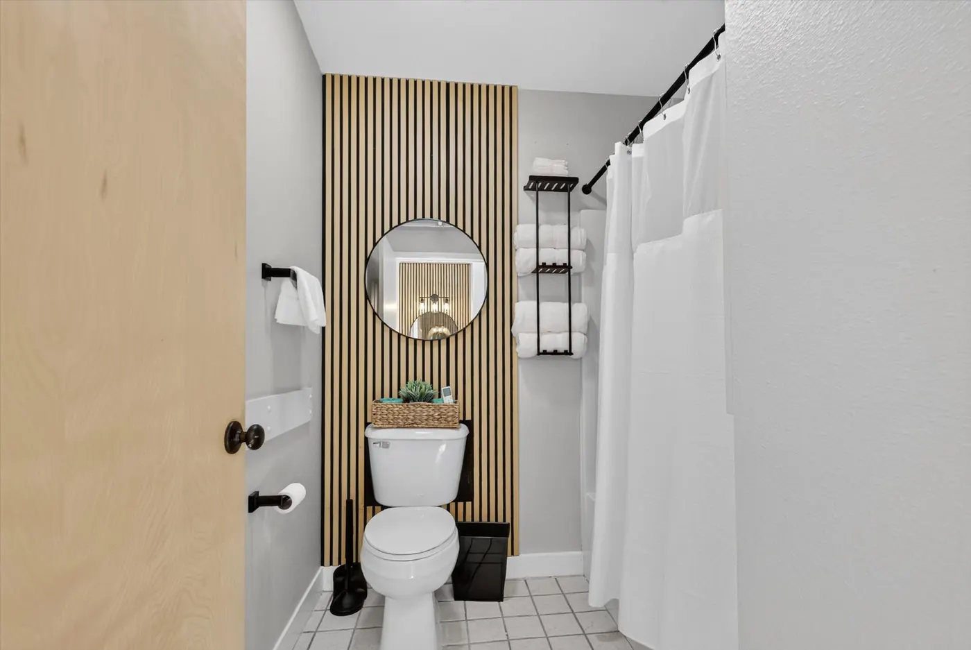 Updated lodge bathroom with shower and wood accent wall