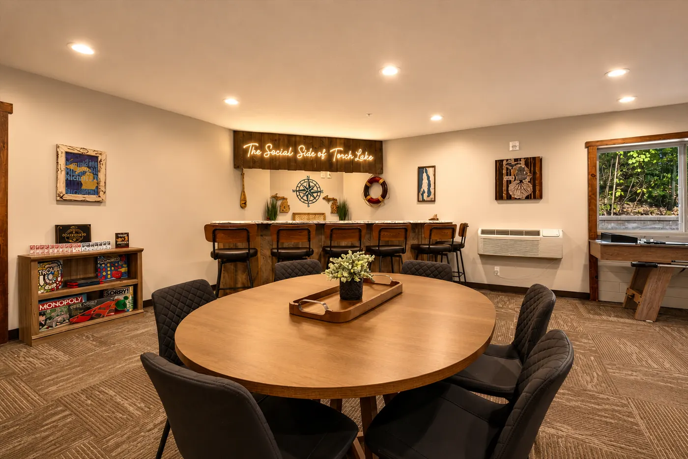 Game table and bar seating in the hangout room