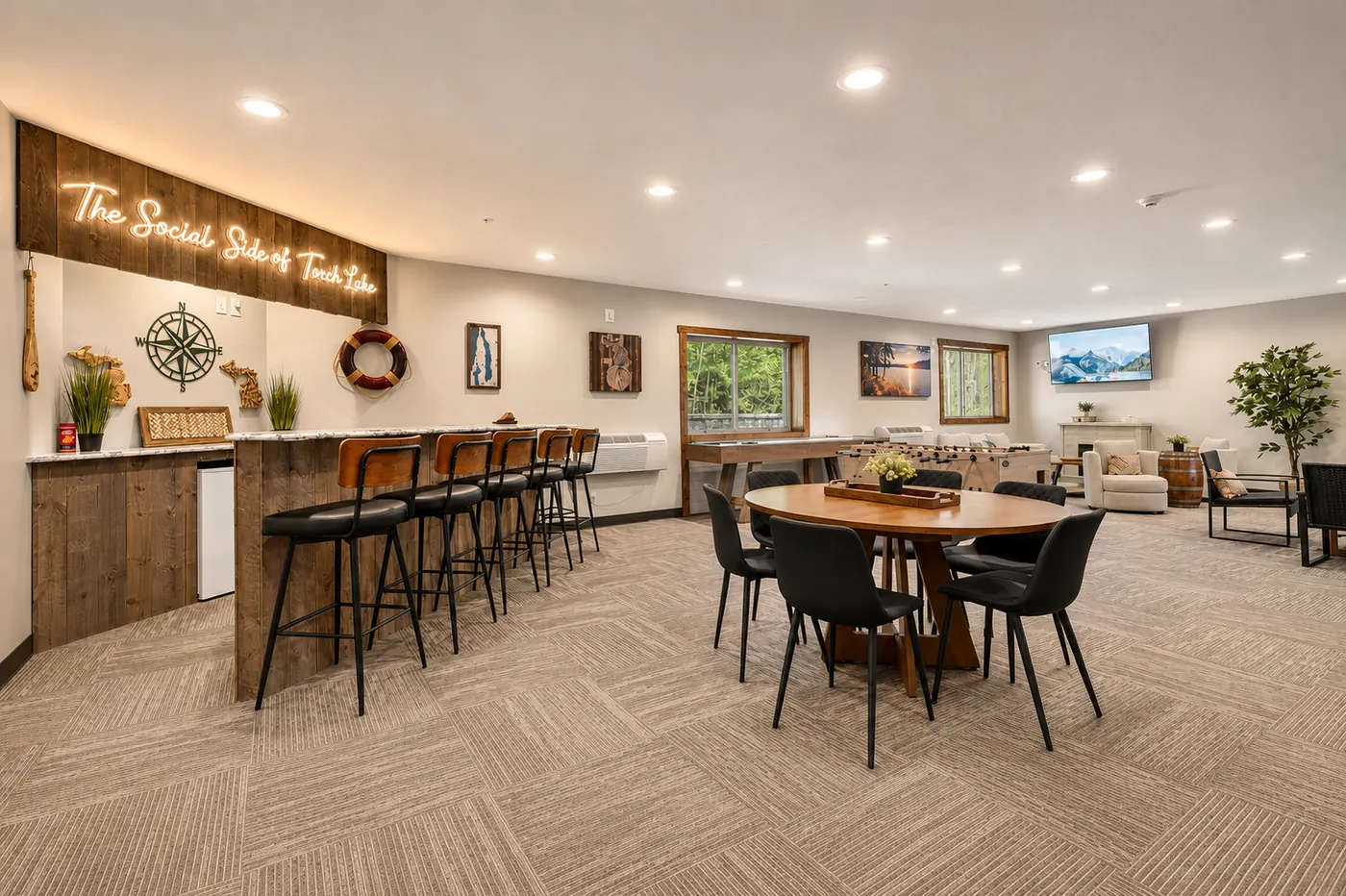 Indoor hangout room with bar, games, and lounge seating