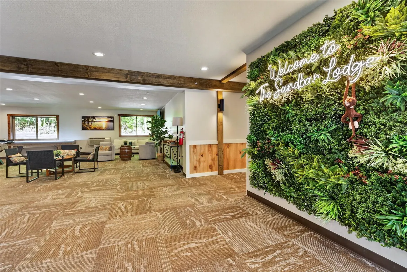 Sandbar Lodge green welcome wall in the lobby