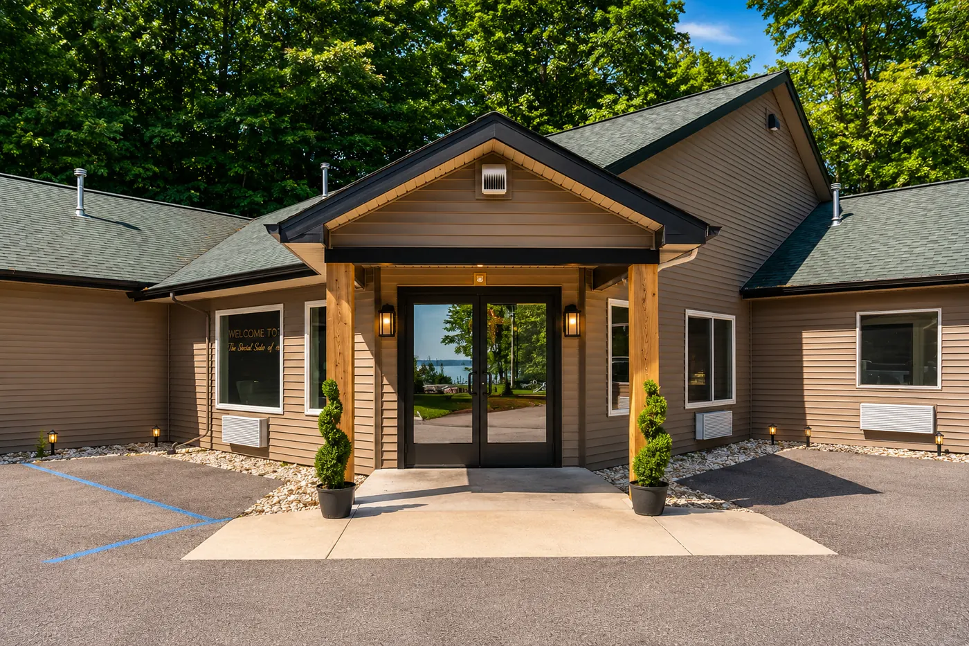 Sandbar Lodge front entrance with lake reflection in the doors