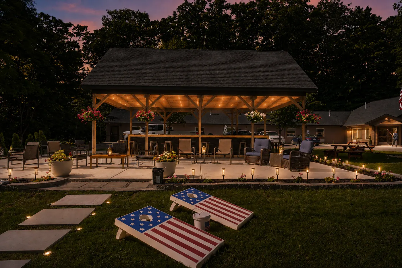 Outdoor pavilion and lawn games at twilight