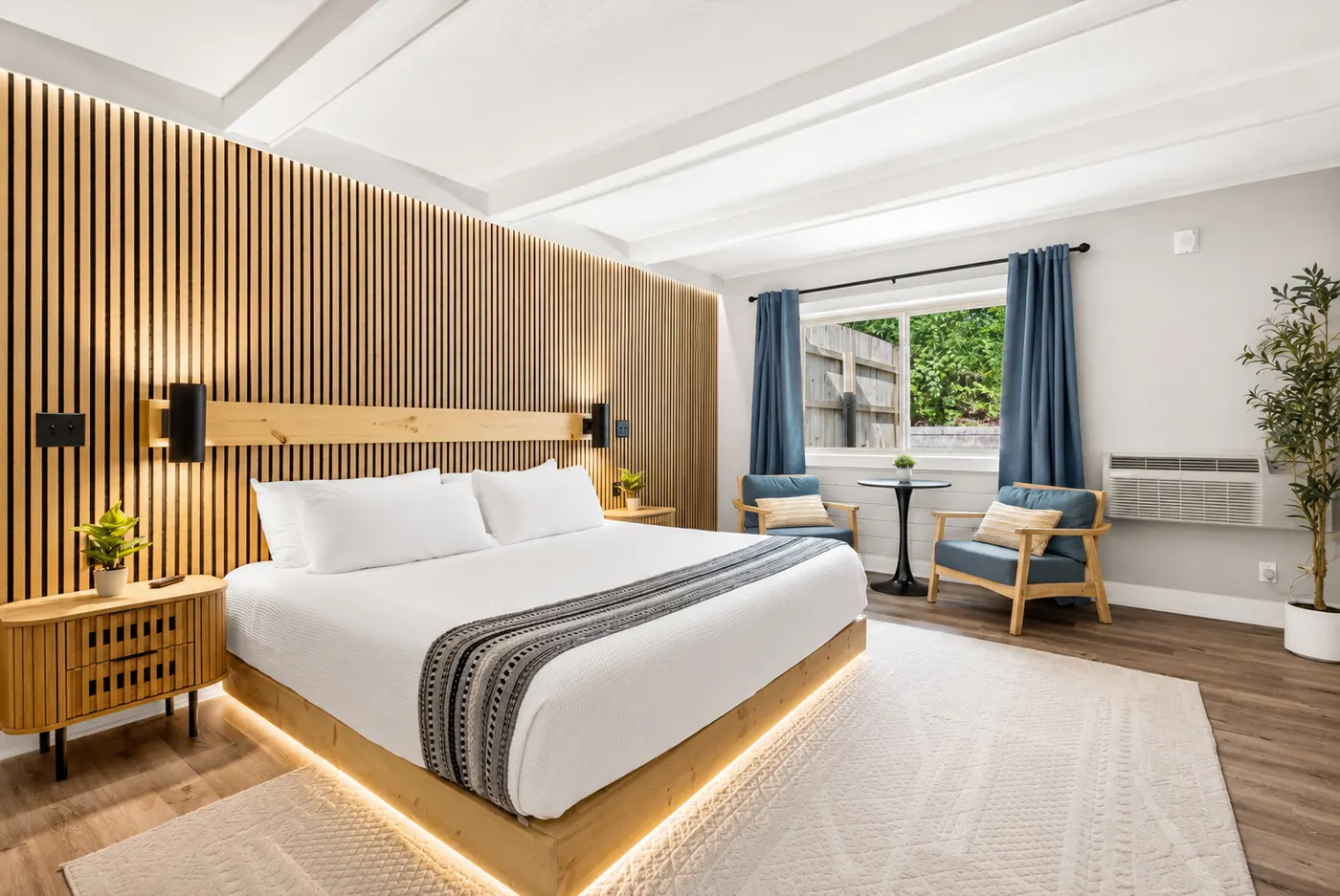 King lodge suite with wood accent wall and king bed