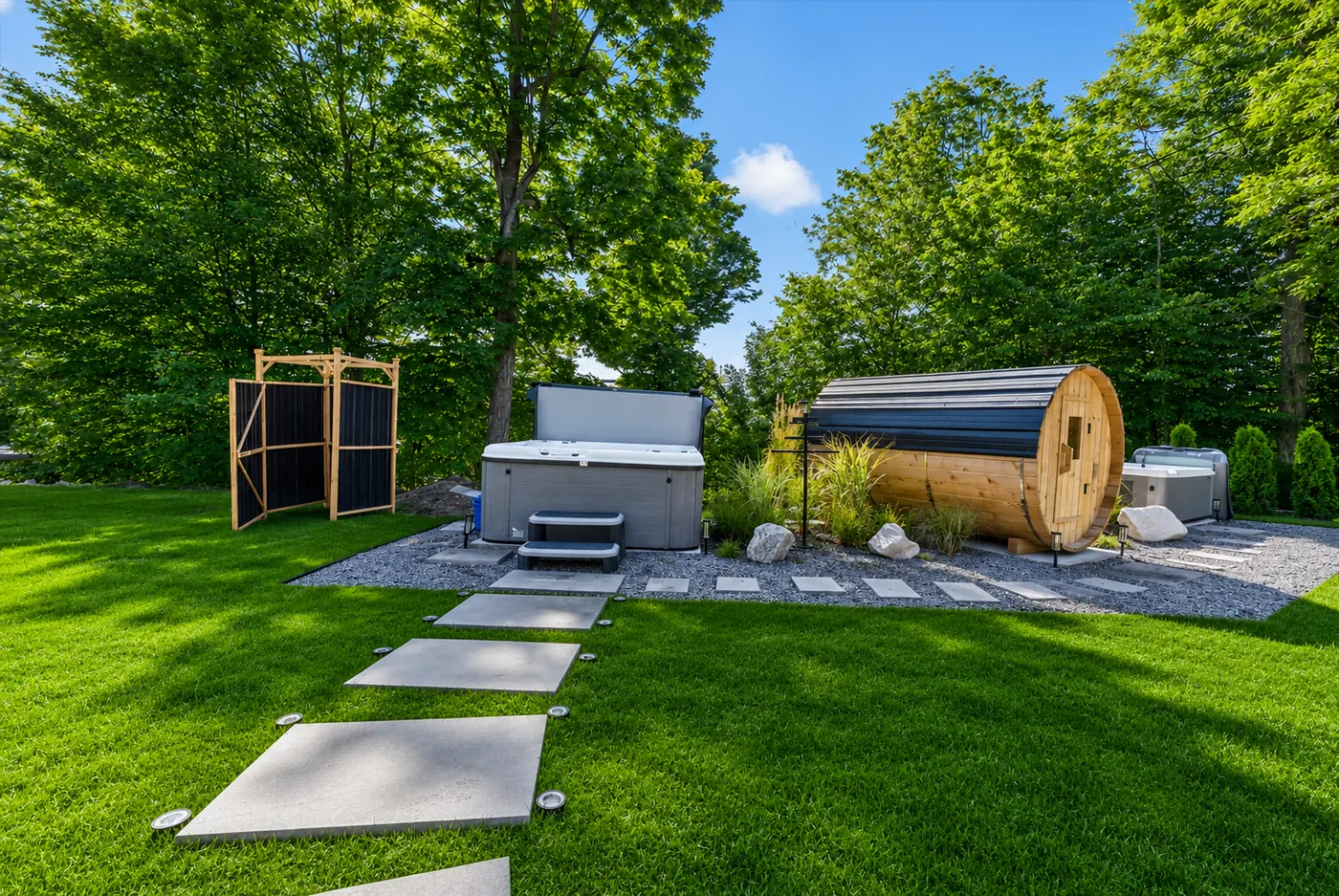 Outdoor wellness area with hot tub, barrel sauna, and cold plunge