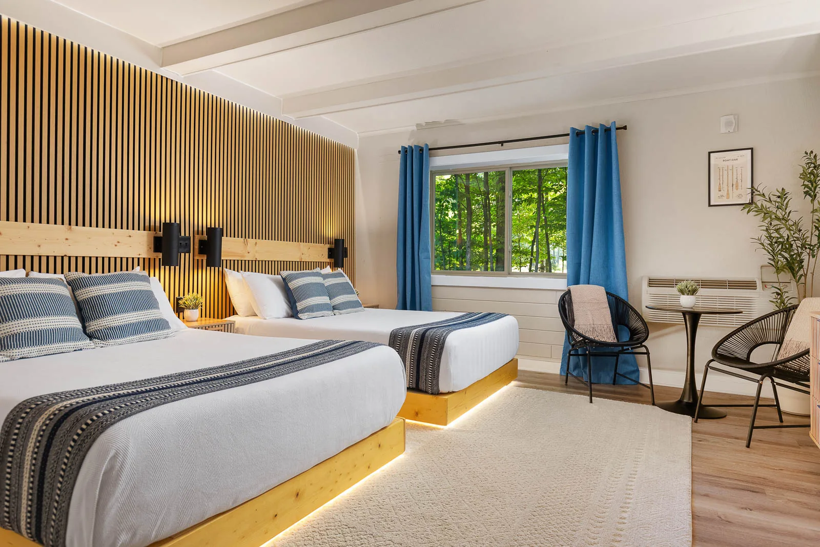 Two Queens Lodge Suite with two queen beds and in-room seating