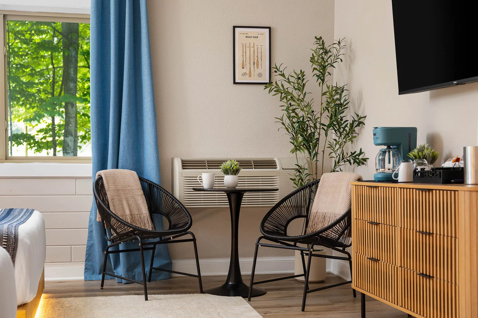 Two Queens Lodge Suite seating beside the window